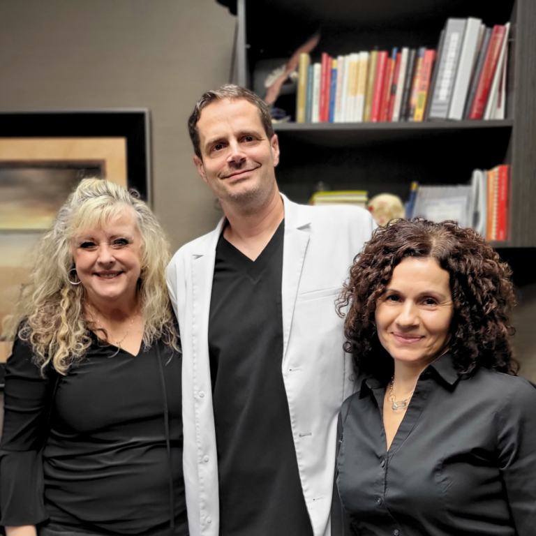 Picture of Doctor Szatkowski DDS and Front Desk Staff at Eagle Falls Dentistry