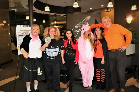 A team of iGaming professionals reviewing data and analytics on multiple screens.